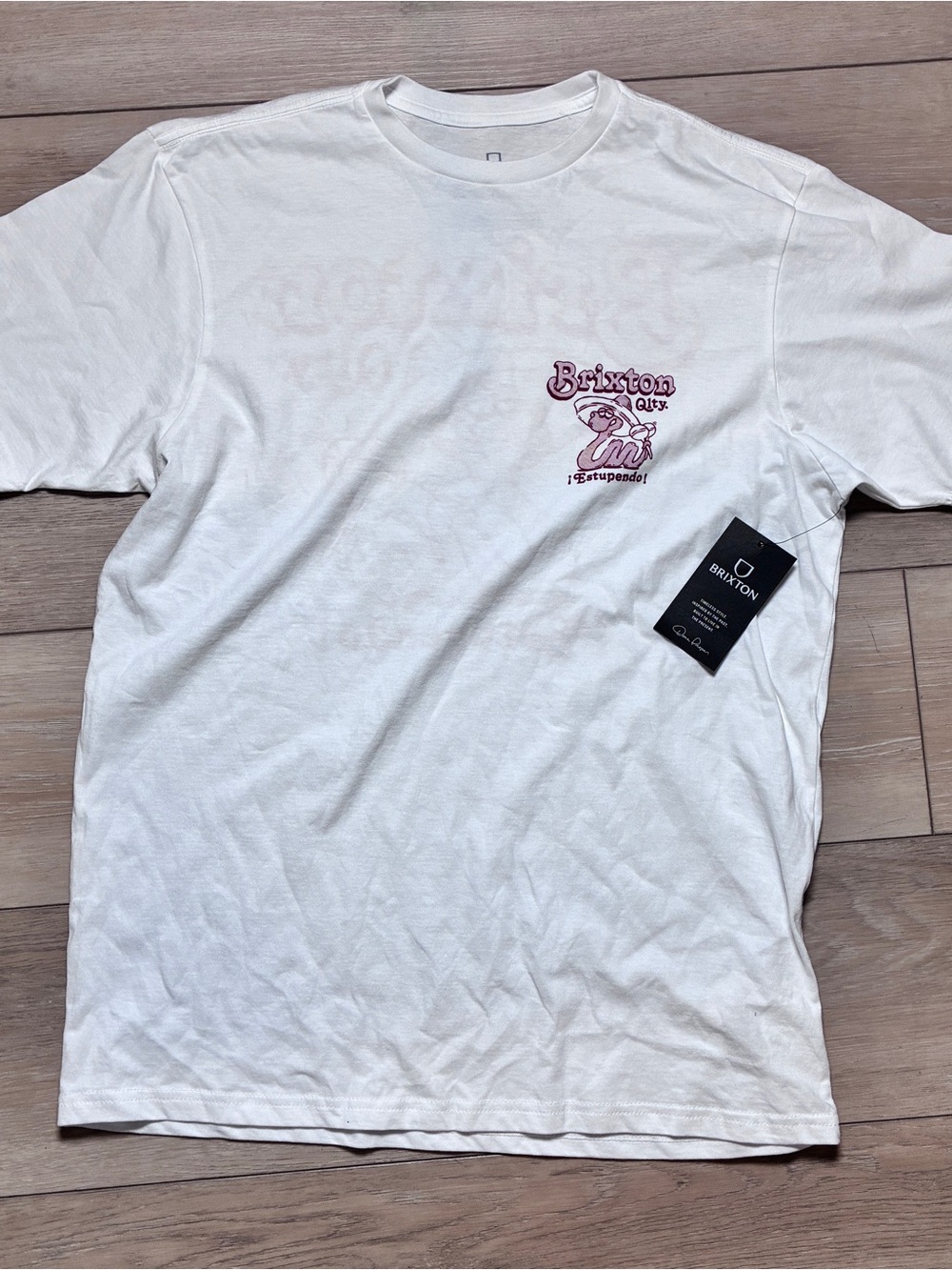Brixton Off-White Short-Sleeve Tee with Pink Chest Graphic